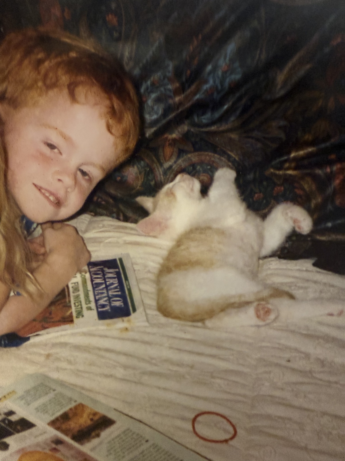 Lee as a kid with the Journal of Accountancy